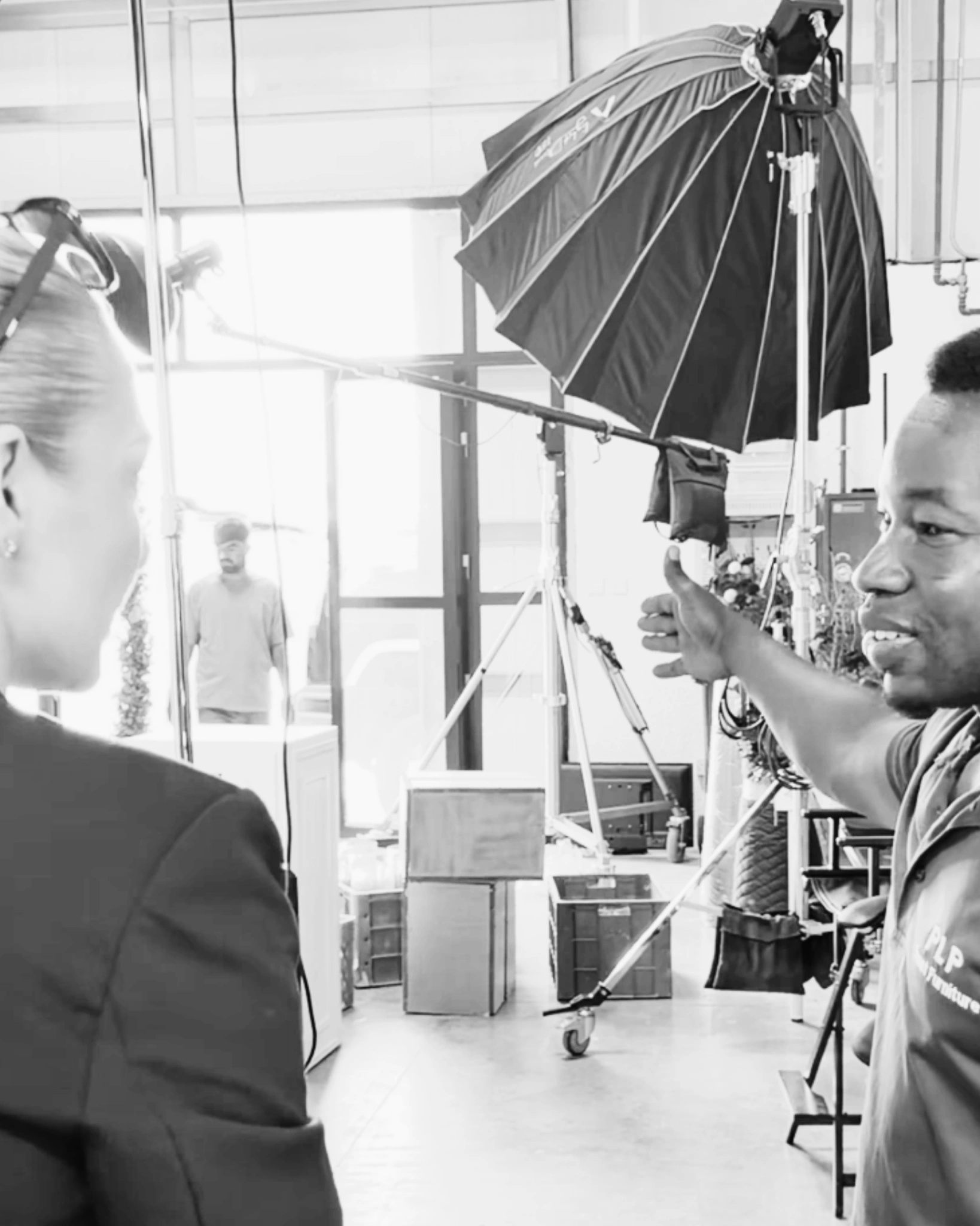 Emily coordinating backstage with the production team during an event shoot